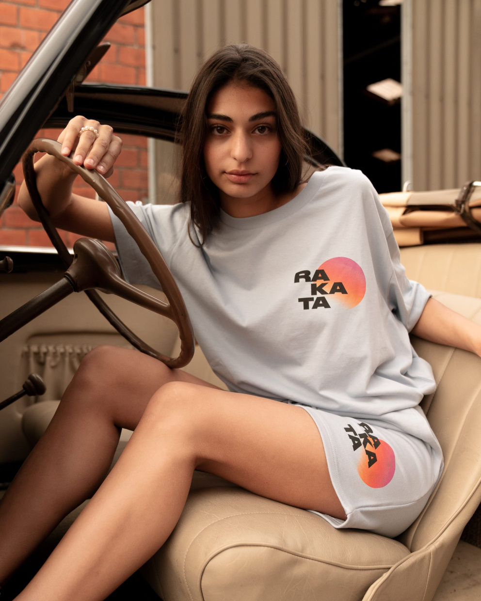 Model wearing a Rakata T-shirt Natural Blue